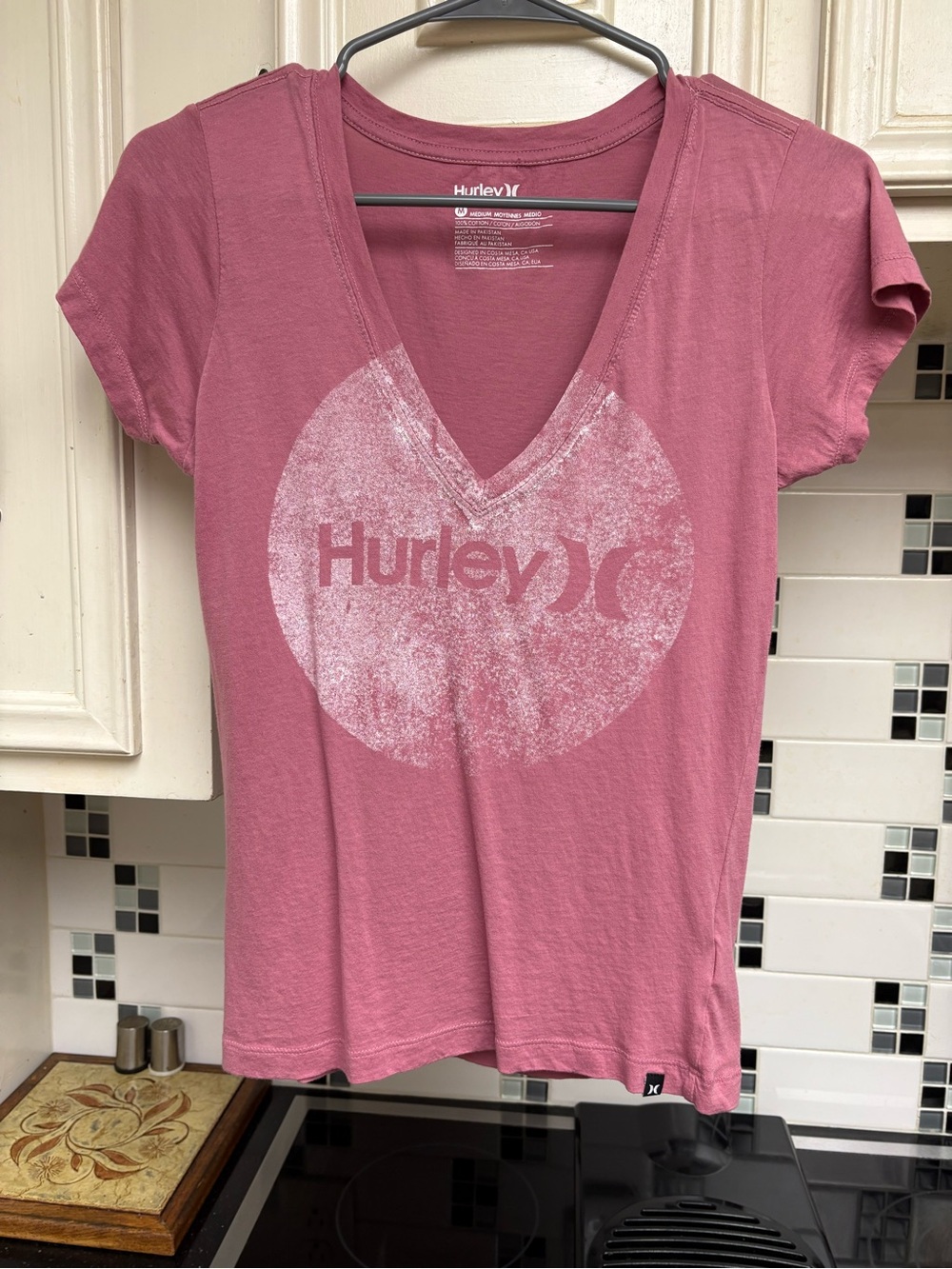 Hurley v-neck t-shirt. Women’s size medium. Rose color